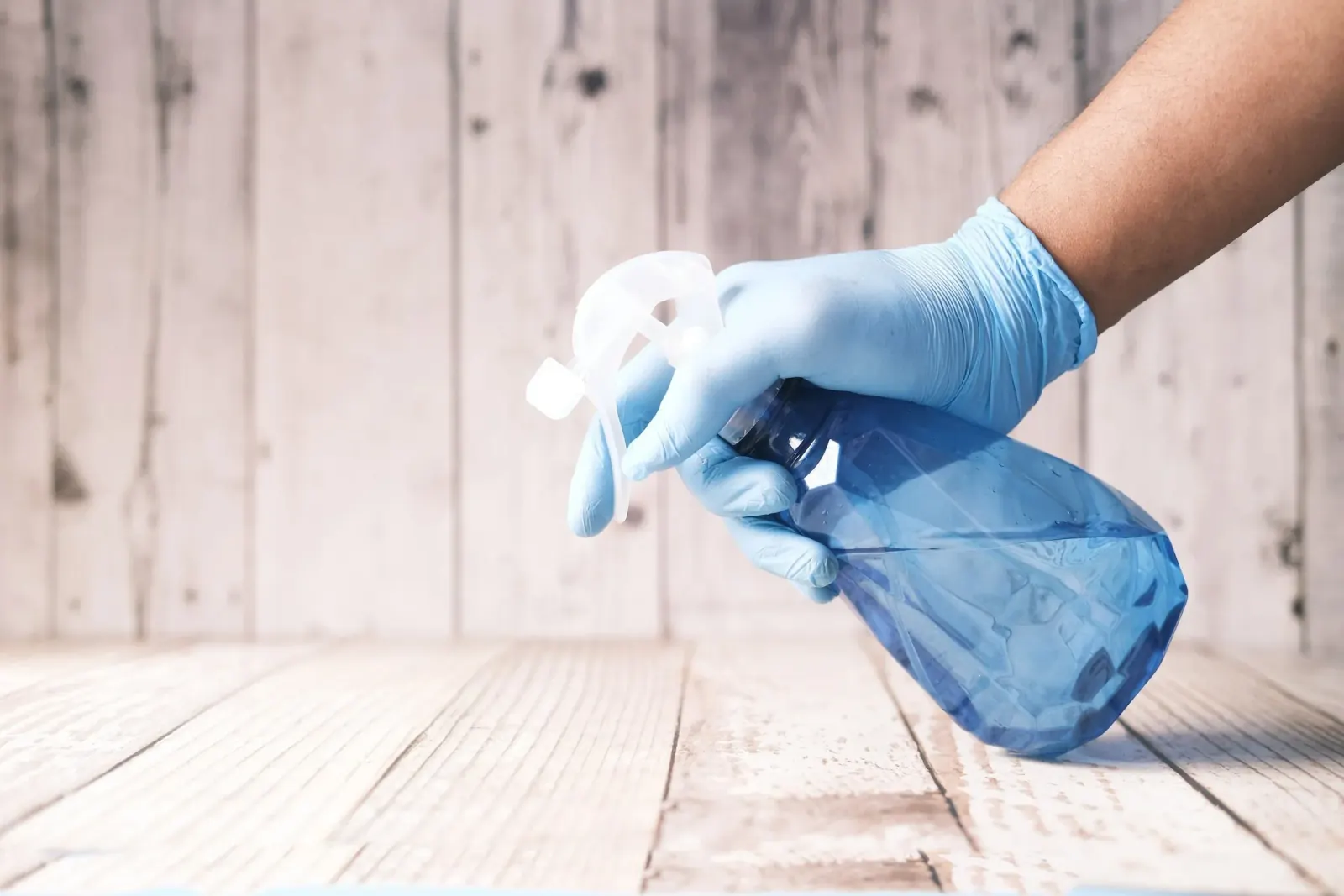 house-cleaner-with-spray-bottle-cleaning-floor-largo-fl